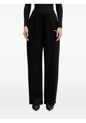 VETEMENTS logo-print track pants - Black