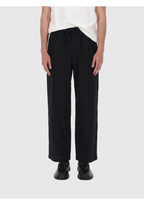 Studio Nicholson Wide-Leg Pinstripe Cotton Trousers with a Drawstring Waist