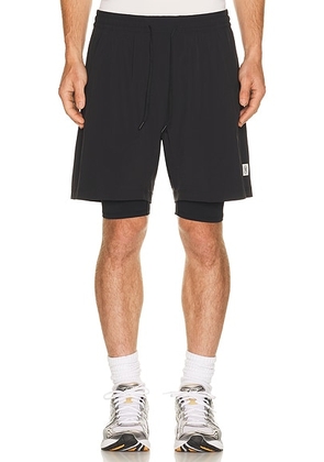 Reigning Champ 4-Way Stretch Nylon Combo Standard Training Short 7 in Black - Black. Size XL/1X (also in M, L, XXL/2X).