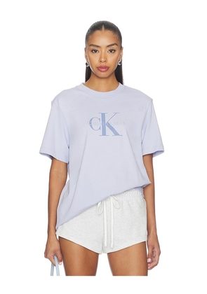 Calvin Klein 20's Short Sleeve Hero Monologo Tee in Blue. Size S. Also in XS, M, L, XL/1X.