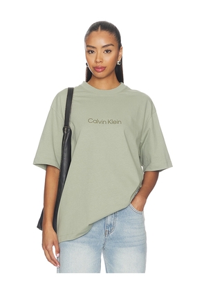 Calvin Klein Relaxed Standard Logo Crew Neck Tee in Green. Size XS. Also in S, M, L, XL/1X.