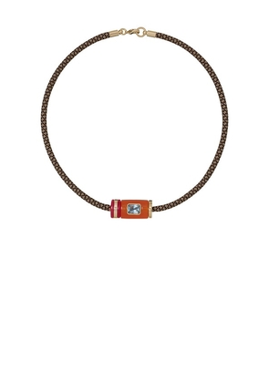 Roxanne Assoulin The Cylinder Cord Necklace in Burnt Orange.
