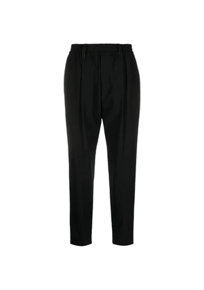 Brunello Cucinelli tapered wool trousers - Black