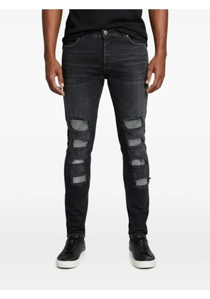 Balmain Pre-Owned crystal-embellished distressed jeans - Black