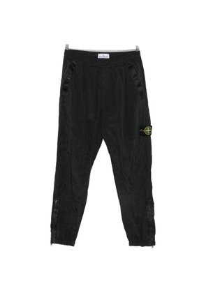 Stone Island logo-patch crinkled track pants - Black