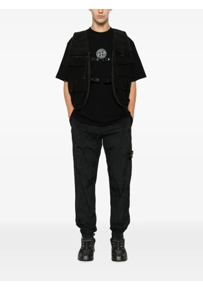 Stone Island logo-patch crinkled track pants - Black