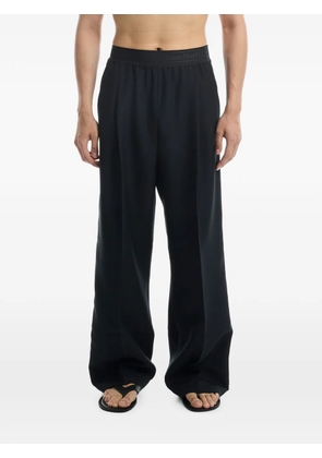 Stockholm Surfboard Club side-stripe wide-leg trousers - Black