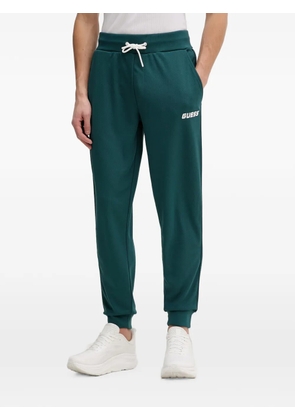GUESS USA logo-print side-stripe track pants - Green