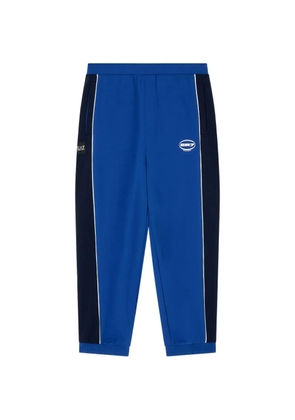 Ea7 Emporio Armani logo-print side-stripe track pants - Blue