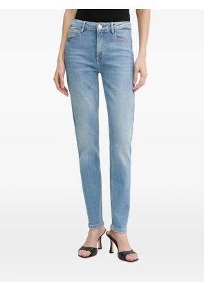 GUESS USA 1981 logo-patch slim-fit jeans - Blue