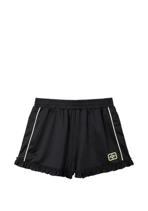 GANNI ruffle-trim shorts - Black