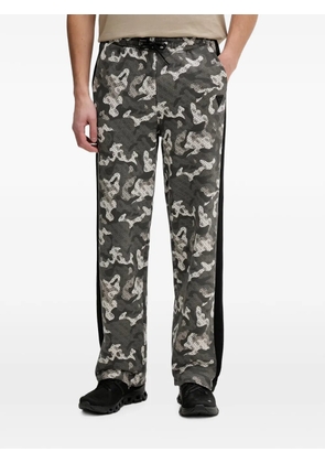 GUESS USA logo-print camouflage-pattern track pants - Grey