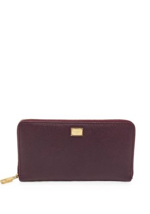 Dolce & Gabbana Pre-Owned logo-plaque zip-around clutch bag - Purple