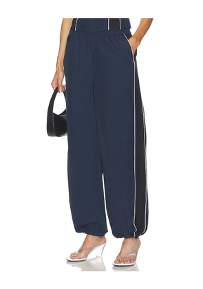 SIMKHAI Falin Jogger Pant in Navy. Size S. Also in .