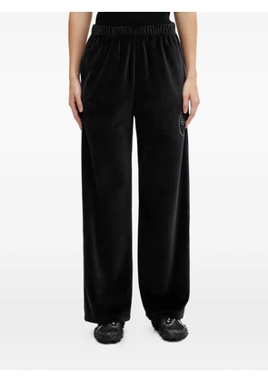 A BATHING APE® rhinestone-embellished velvet trousers - Black
