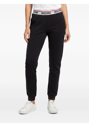 Moschino Pre-Owned logo-tape track trousers - Black