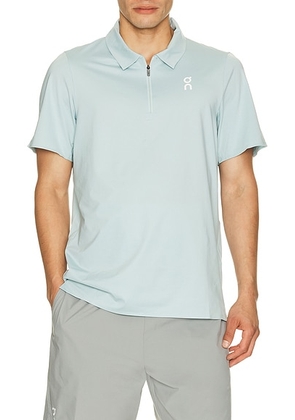 On Court Polo in Brook - Blue. Size L (also in XS, S, M, XL/1X, XXL/2X).