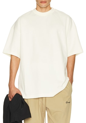 Fear of God ESSENTIALS Signature 90's Short Sleeve Tee in Ivory - White. Size M (also in L, S, XL/1X, XS, XXL/2X, XXXL/3X).