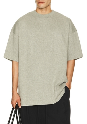 Fear of God ESSENTIALS Signature 90's Short Sleeve Tee in Concrete Heather - Grey. Size XL/1X (also in L, M, S, XS, XXL/2X, XXXL/3X).