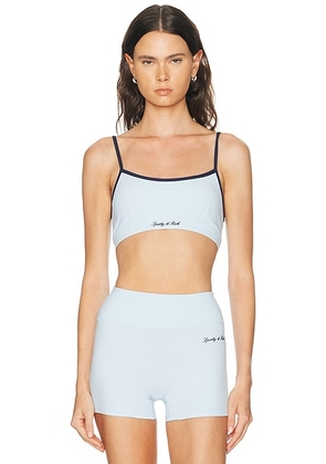 Sporty & Rich Signature Logo Sports Bra in Ciel & Dark Navy - Baby Blue. Size XS (also in S, M, L).