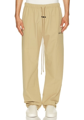 Fear of God ESSENTIALS Signature Track Pant in Dune - Grey. Size S (also in XS, M, L, XL/1X, XXL/2X, XXXL/3X).