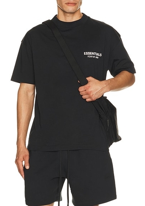 Fear of God ESSENTIALS Classic Fit T-shirt Back Logo in Vintage Black - Black. Size XL/1X (also in S, XS, M, L, XXL/2X).