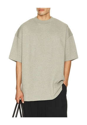 Fear of God ESSENTIALS Signature 90's Short Sleeve Tee in Grey. Size XS. Also in S, M, L, XL/1X, XXL/2X, XXXL/3X.