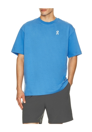 On Club T in Blue. Size XS. Also in S, M, L, XL/1X, XXL/2X.
