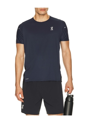 On Performance-T in Navy. Size XS. Also in S, M, L, XL/1X, XXL/2X.