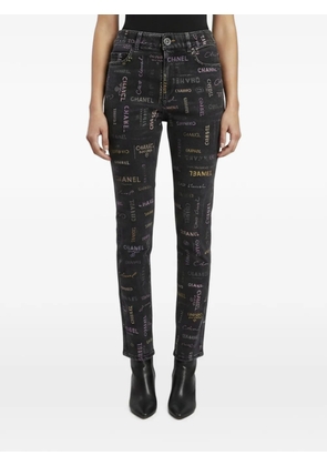 CHANEL Pre-Owned logo-printed regular-fit jeans - Grey