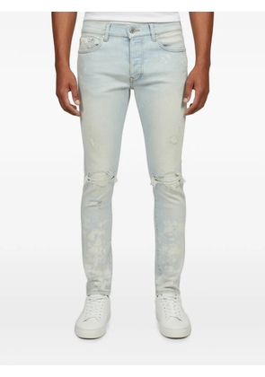 AMIRI distressed skinny-cut jeans - Blue