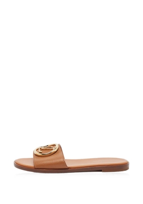 Louis Vuitton Pre-Owned Lock It flat sandals - Brown