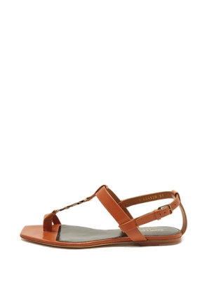 Saint Laurent Pre-Owned Cassandra flat sandals - Brown