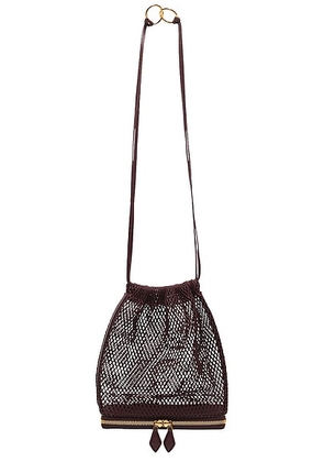 ALAÏA Le Pochon Bag in Rouge Grenat. Size all.