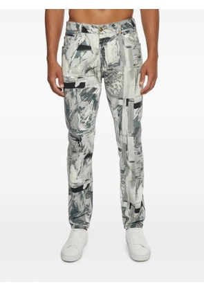 Versace Pre-Owned abstract brushstroke-print jeans - White