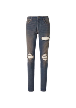 AMIRI distressed ribbed-panel jeans - Blue