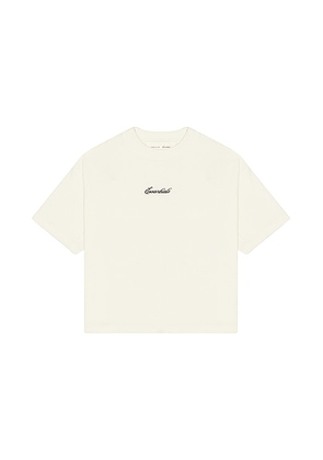 Fear of God ESSENTIALS Kids Signature 90's Short Sleeve Tee in Ivory - Ivory. Size 4/5 (also in 2/3, 6/7).