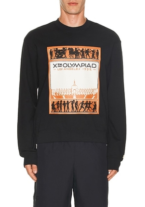 JOHN ELLIOTT X Olympics Los Angeles Crewneck Sweatshirt in Black - Black. Size M (also in ).