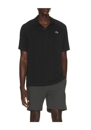 Lacoste Polo in Black. Size 3. Also in 4, 5.