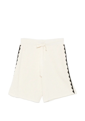 COMMAS triangle-embroidered shorts - White