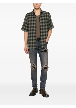 AMIRI Ultrasuede MX1 distressed slim-fit jeans - Blue