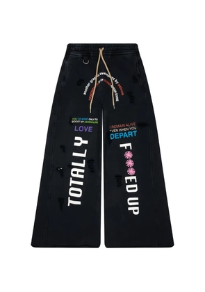 astrum TFU text-print wide-leg track pants - Black