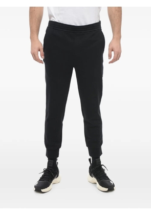 Neil Barrett logo-embroidered skinny-fit track pants - Black