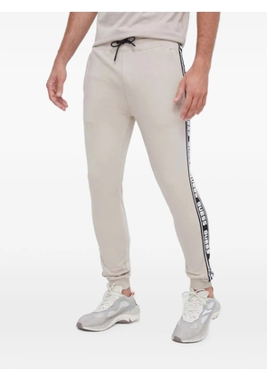 GUESS USA logo-tape track pants - Neutrals