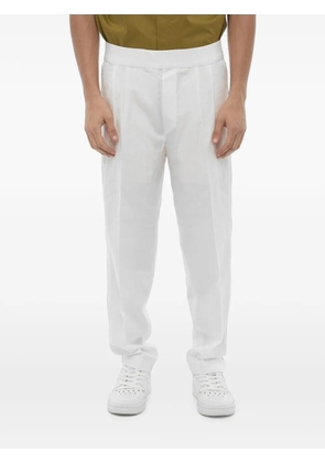 Neil Barrett double-pleat elasticated-waist tapered trousers - White