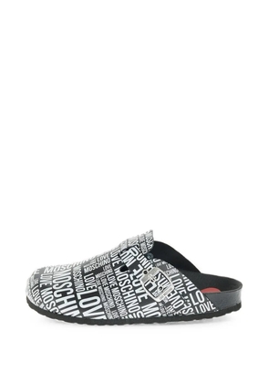 Moschino logo-print buckle sandals - Black