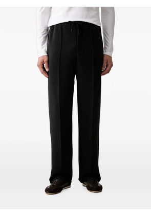 GUESS USA logo-patch drawstring track pants - Black
