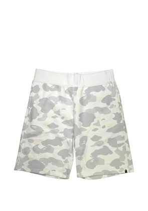 A BATHING APE® glow-in-the-dark camo-print shorts - White