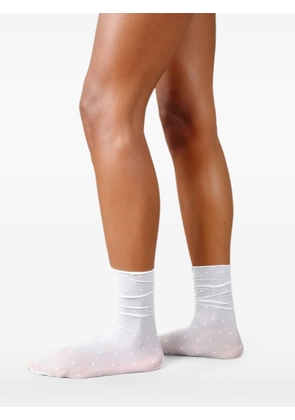 Swedish Stockings Lina polka-dot sheer socks - White