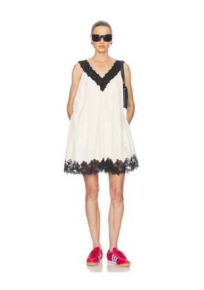Helsa Mini Dress With Lace in Tech Poplin in Cream. Size XS. Also in S, M, L, XL.